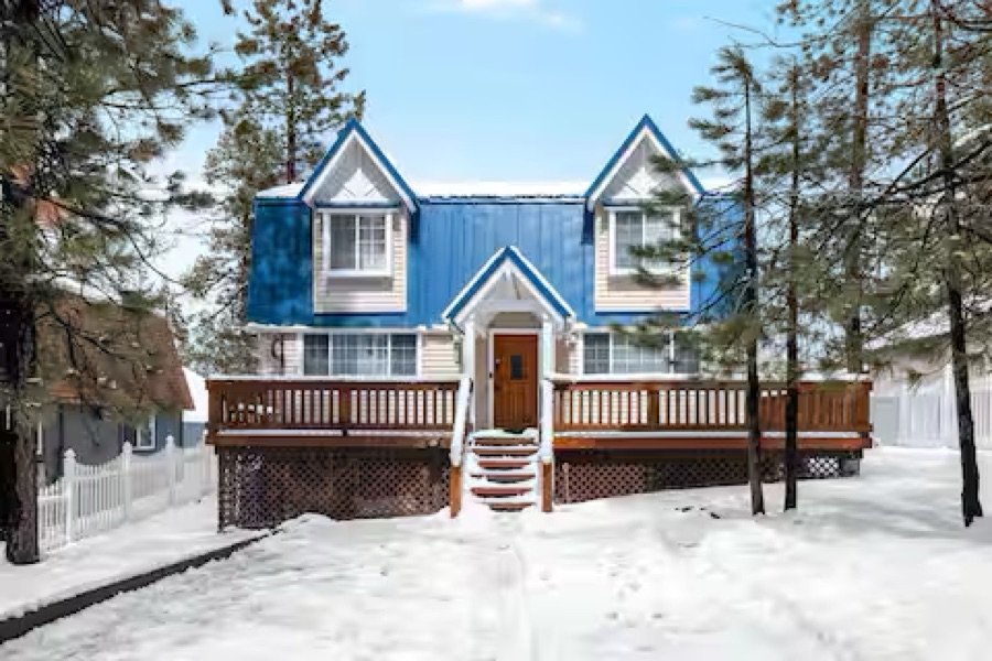 The HappyNest cabin in winter, deck and steps under fresh Big Bear snow